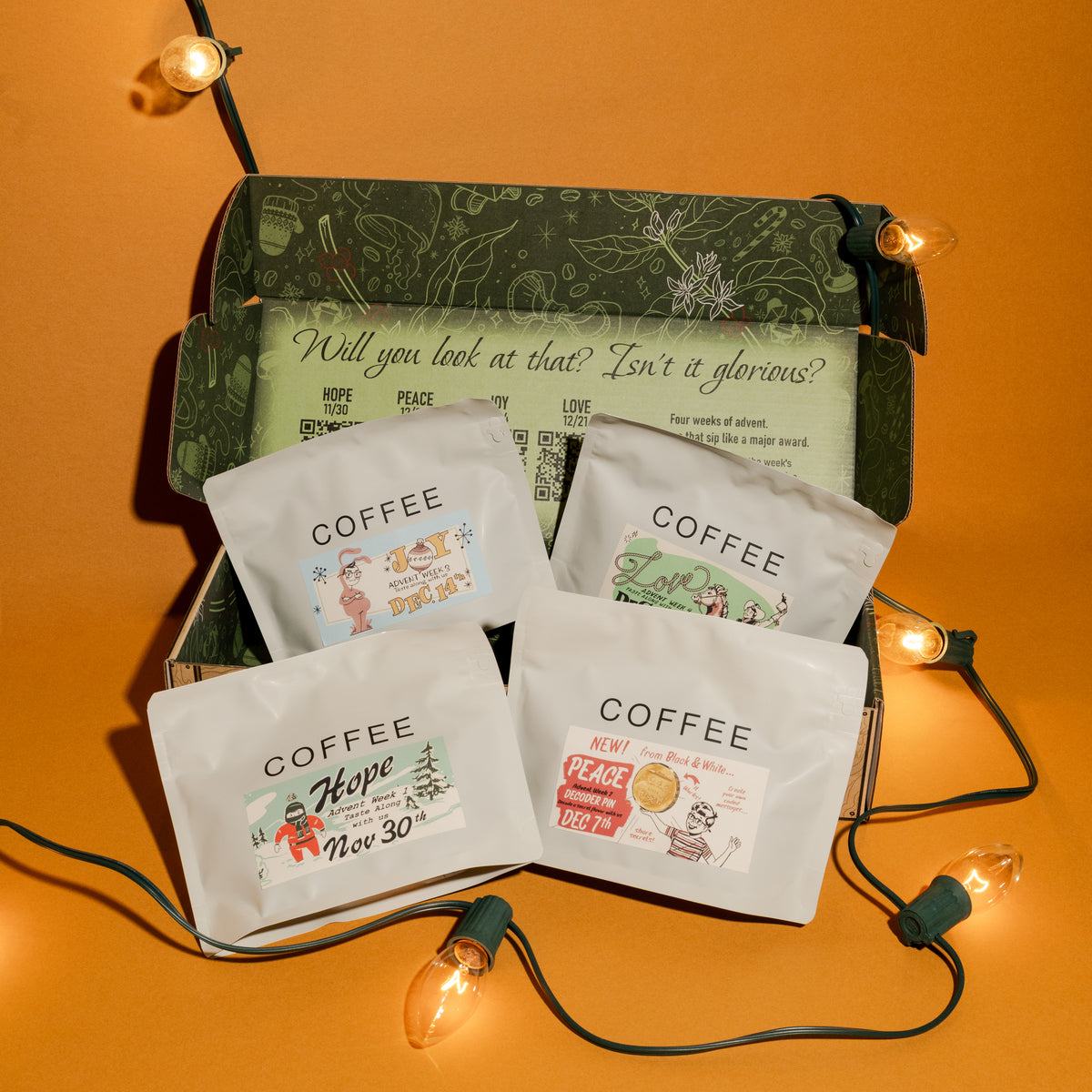 2025 B&W Advent Calendar: A holiday coffee kit with four themed bags for each Advent week—Hope, Peace, Love, Joy—inside a decorative box.