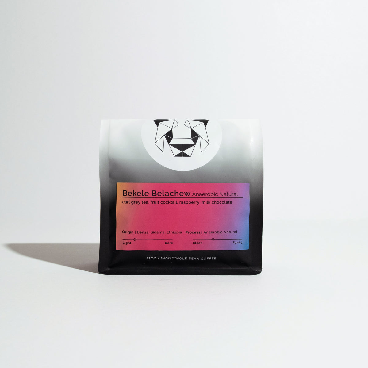 Bekele Belachew Anaerobic Natural whole-bean coffee, 12 oz bag with gradient label, showcasing tasting notes and origin details.