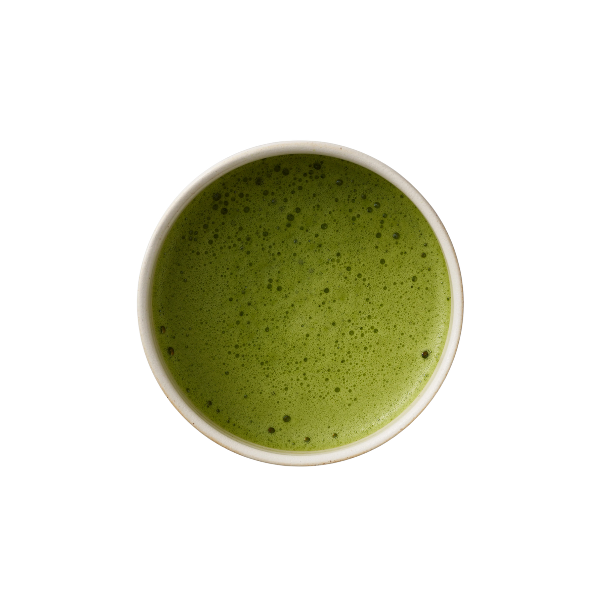 Ceramic bowl filled with green matcha powder on a white background