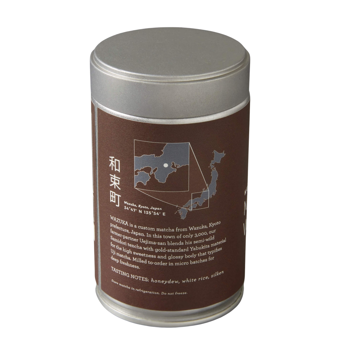 tea container with brown label and silver lid on a white background
