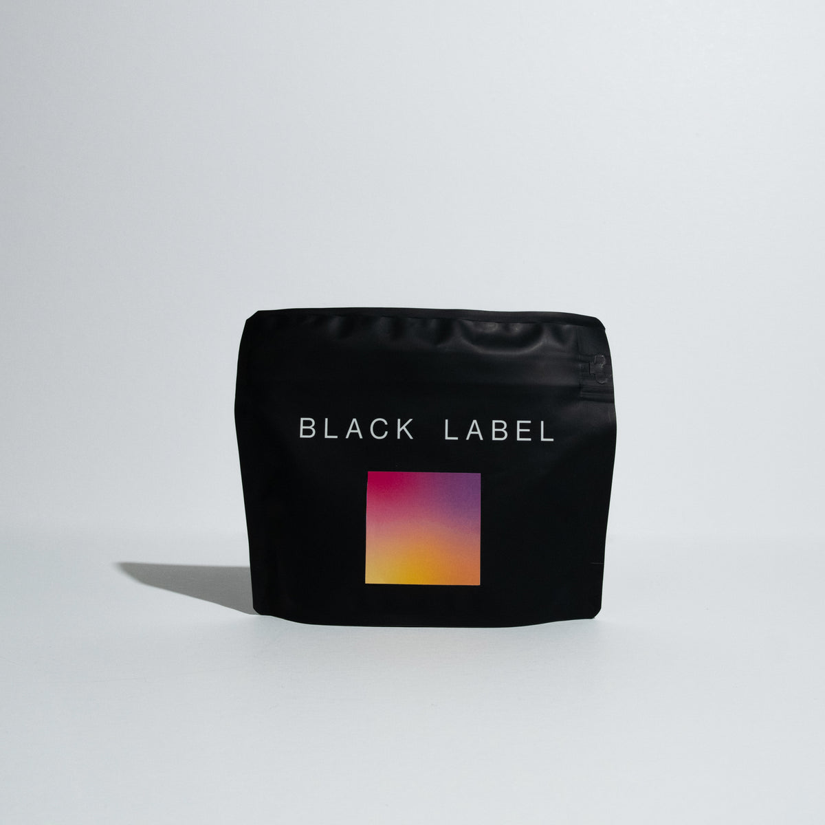 Bag of El Burro - Natural Gesha Lot E coffee in front of a white background