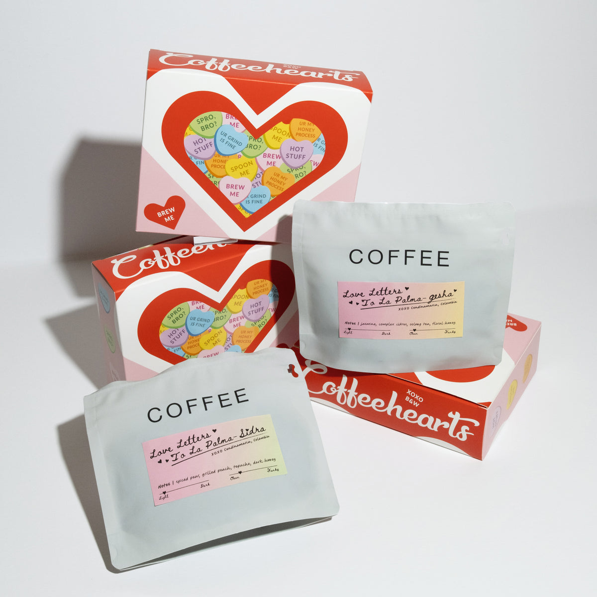 Valentine-themed coffee set featuring Love Letters to La Palma pouches and Coffeehearts gift boxes with heart-shaped pods, ideal for gifting.
