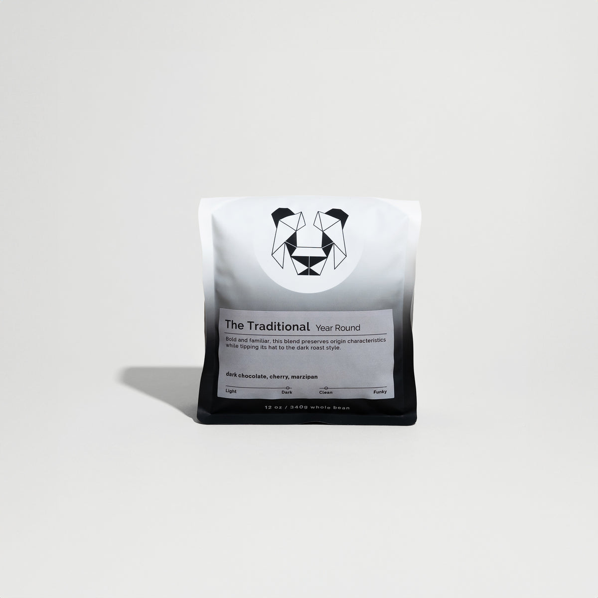 The Traditional coffee package, labeled as a dark roast from Ethiopia, featuring notes of dark chocolate, cherry, and marzipan, sits on display.