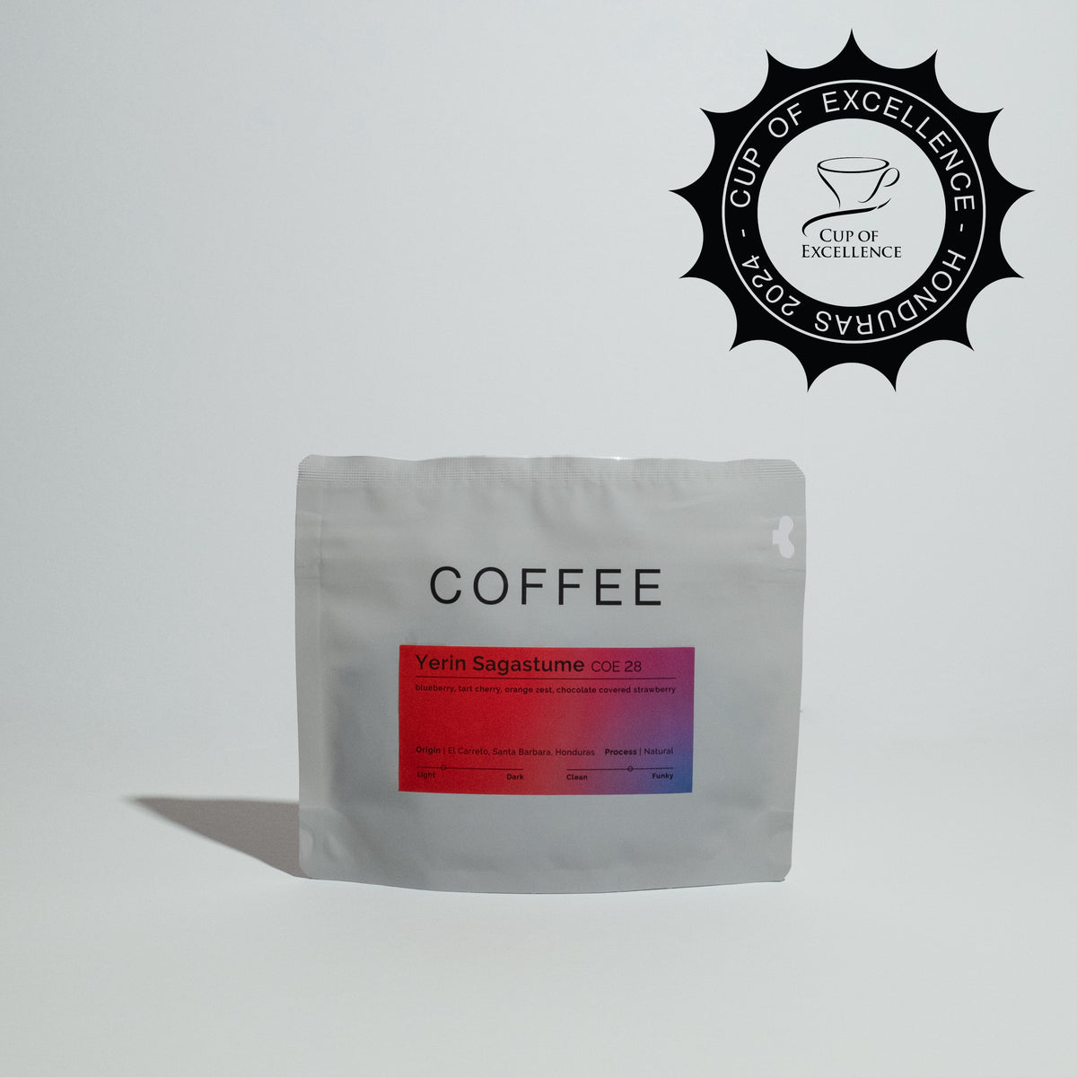 Yerin Sagastume - COE 28 coffee beans, showcased in packaging, highlighting their origin from Santa Barbara, Honduras, emphasizing specialty SL-28 variety and vibrant fruity notes.
