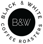 A black circle with minimal and modern san serif letters in the middle that says "B&W." The circle has the words "Black & White" around the top and "Coffee Roasters" around the bottom.
