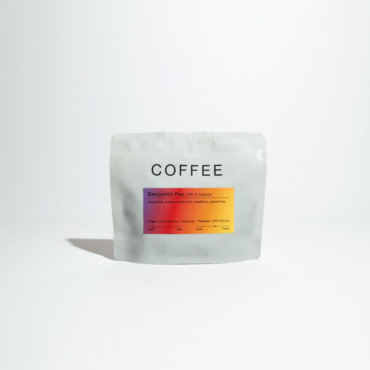 Resealable pouch labeled “COFFEE” featuring “Benjamin Paz DRD Ensalada” with tasting notes: bergamot, raspberry, peach tea; origin: Santa Barbara, Honduras.
