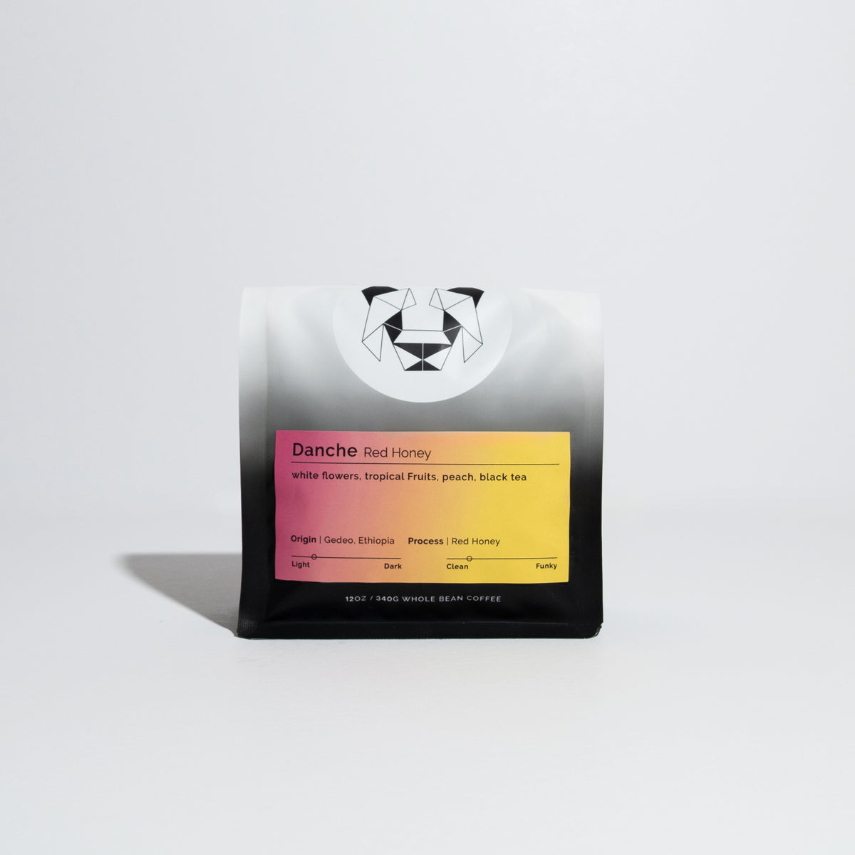 Standing pouch of Danche - Red Honey whole-bean coffee from Gedeo, Ethiopia, featuring tasting notes of white flowers, tropical fruits, peach, and black tea.