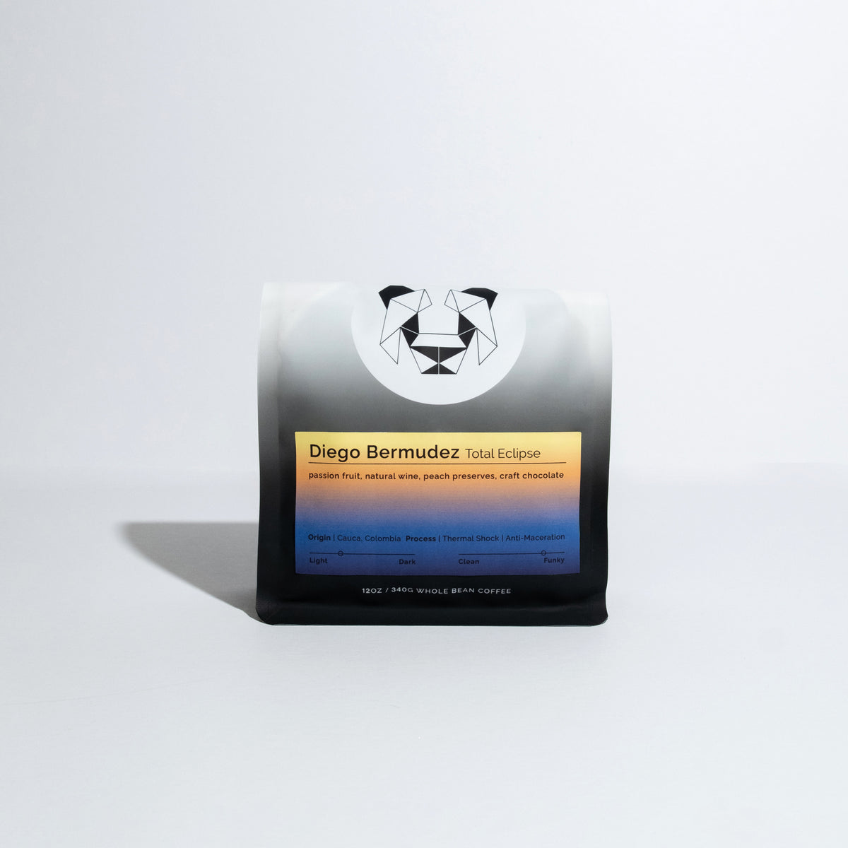 A bag of coffee on a white background with a multicolored label that says Diego Bermudez Total Eclipse.