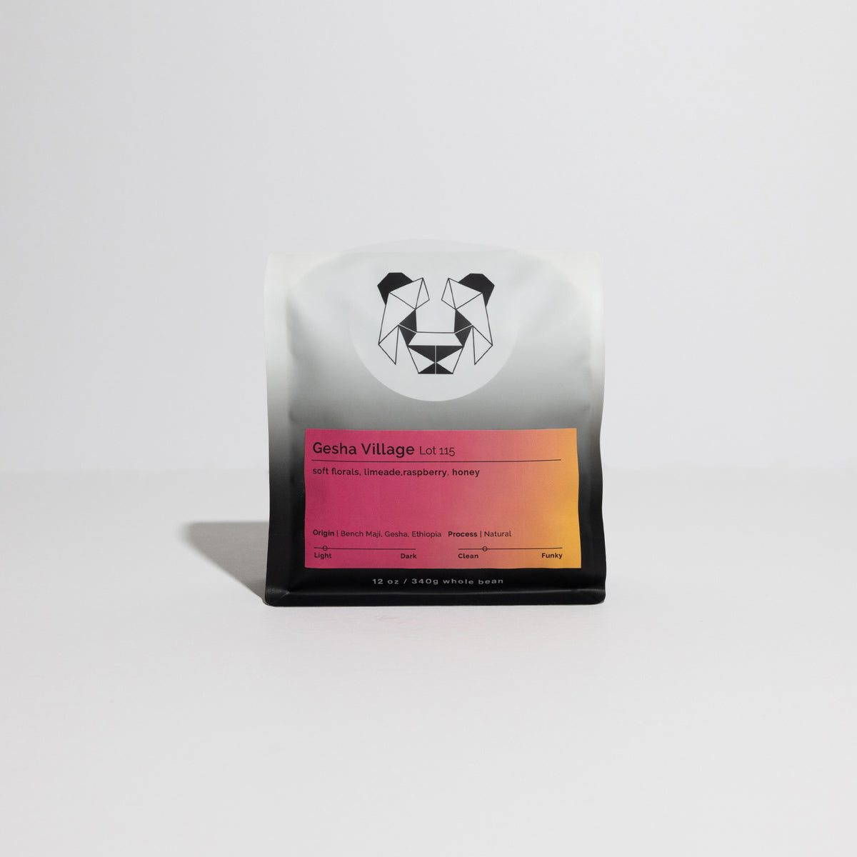 Gesha Village - Lot 115 coffee beans from Ethiopia, naturally processed, known for floral and fruity notes, showcased in packaging highlighting the renowned Gesha Village estate.