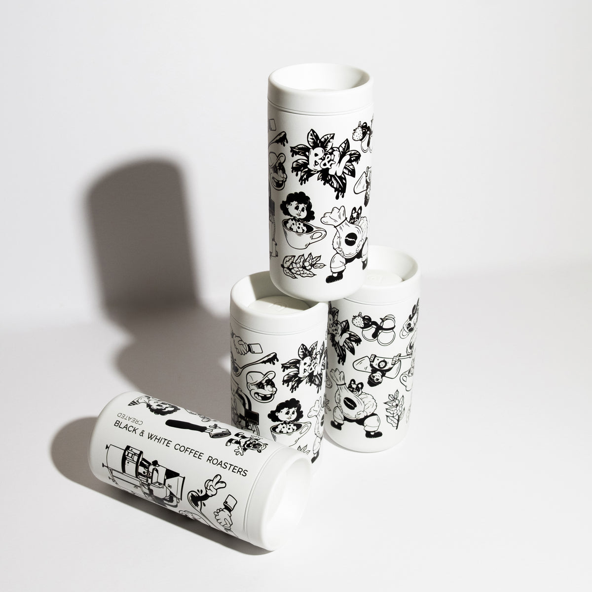 Panda Mailer Travel Cup with black-and-white cartoon illustrations, 12oz capacity, leak-proof twist lid, designed by Ghost Town Art for temperature retention.