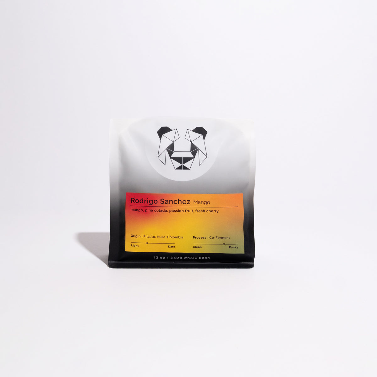 Rodrigo Sanchez Mango coffee bag, 12 oz whole-bean, features a geometric logo, gradient label with origin, tasting notes, and co-ferment process highlights.