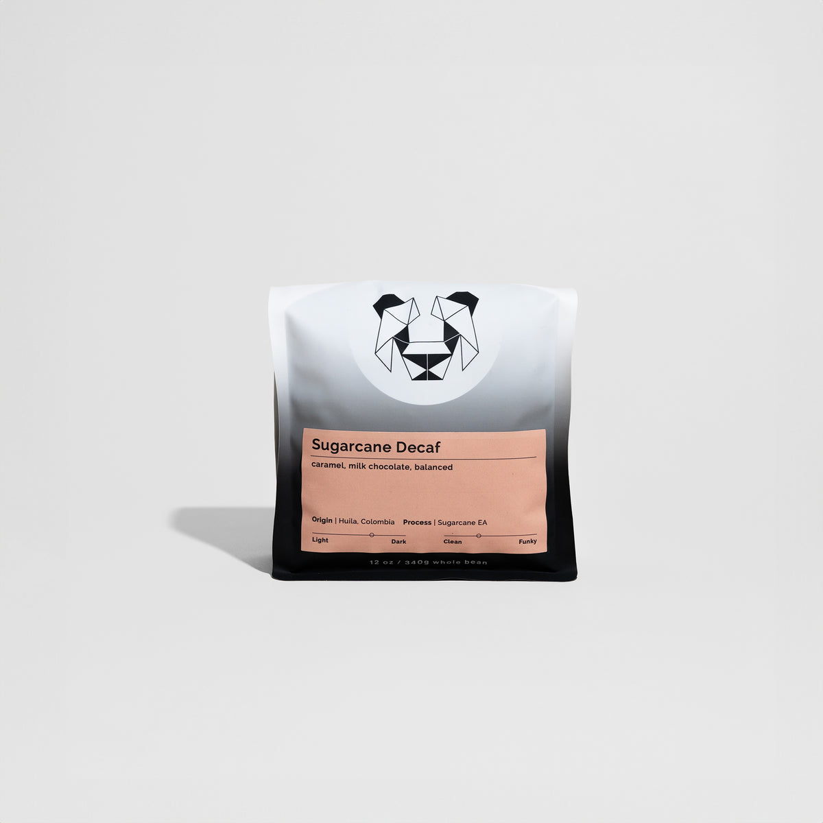 Sugarcane Decaf coffee beans from Hulia, Colombia, highlighting medium-dark roast with caramel and milk chocolate notes, processed using the Sugarcane Decaffeination method.