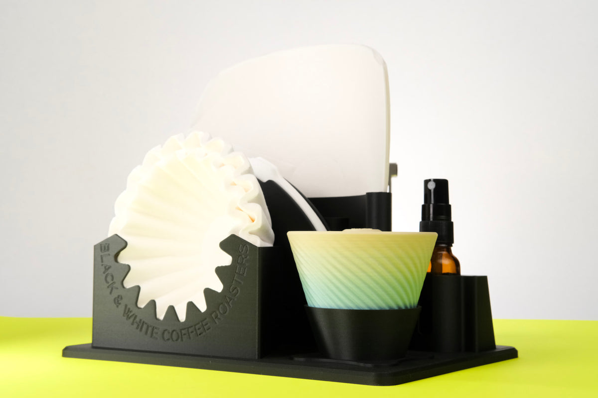 B&W Lab - Filter Holder displayed with coffee filters and accessories, showcasing its organized compartments for brewing tools and optional Garage Riser Kit for scale storage.