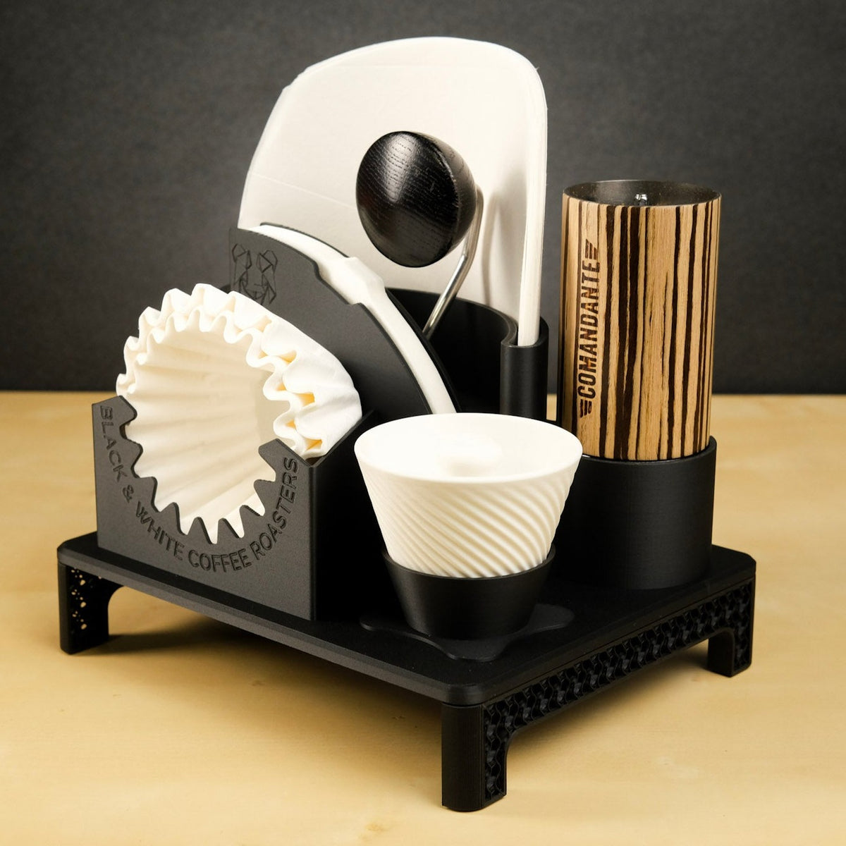 B&W Lab - Filter Holder; an elegant countertop organizer for various coffee filters, featuring compartments for a grinder, crank, and spray bottle.